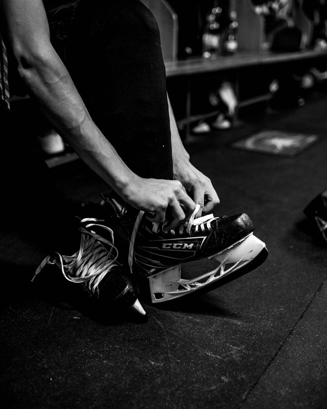 A player lacing up skates