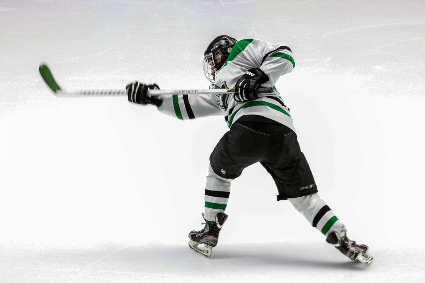 A player winding up a slap shot